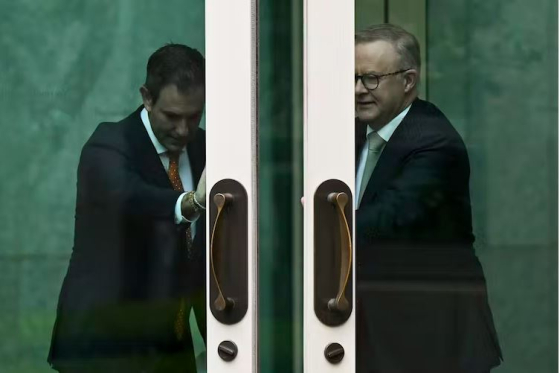 Prime Minister Anthony Albanese and Treasurer Jim Chalmers opening door