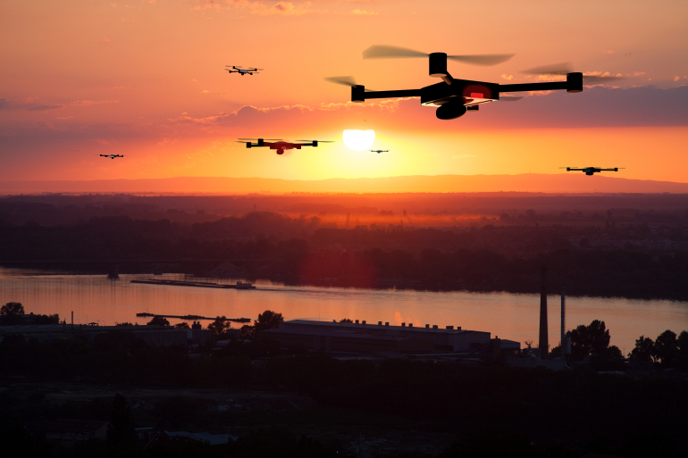 Aerial drones against sunset.